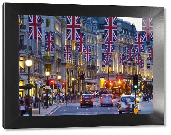 UK, England, London, Regent Street, Taxis and Union Jack Flags