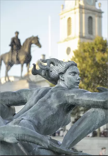 Statue in a fountain in Trafalgar Square, London, England, UK