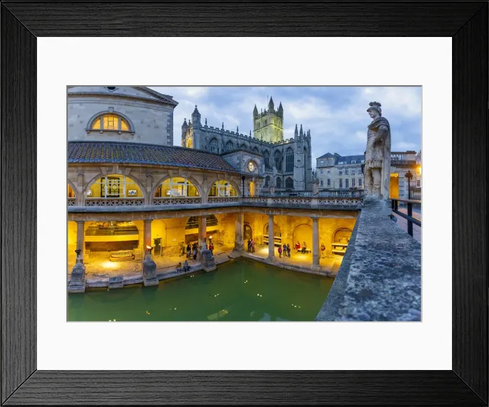 Framed Print : The Roman Baths and Bath Cathedral illuminated at dusk, Bath, Somerset, England