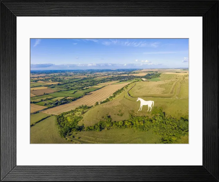 Framed Print : Aerial view of the famous White Horse below Bratton Camp, an Iron Age hillfort near