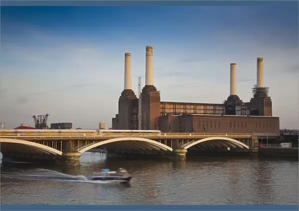 England, London, Chelsea, Train crossing Grosvenor bridge infront of Battersea power