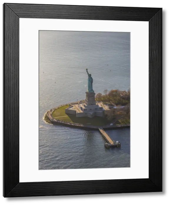 Framed Print : Aerial view over the Statue of Liberty, Manhattan, New York City, USA Framed Print : Aerial view over the Statue of Liberty, Manhattan, New York City, USA