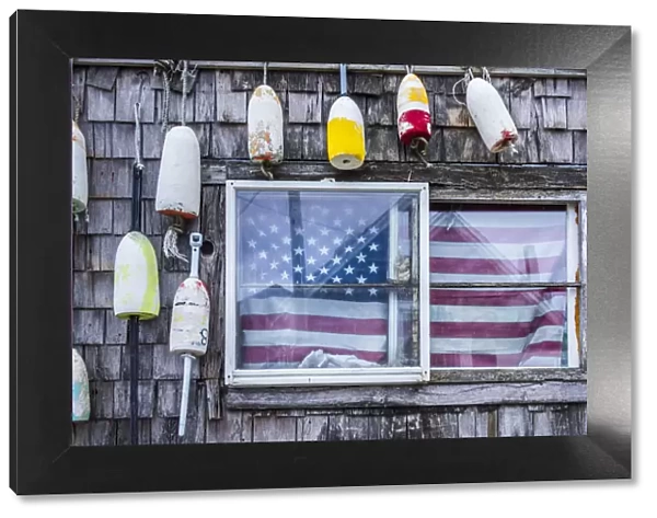 USA, Massachusetts, Cape Ann, Rockport, lobster buoys and US flag
