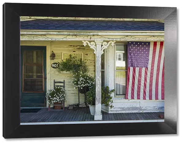 USA, Maine, Cundys Harbor, US flag on porch