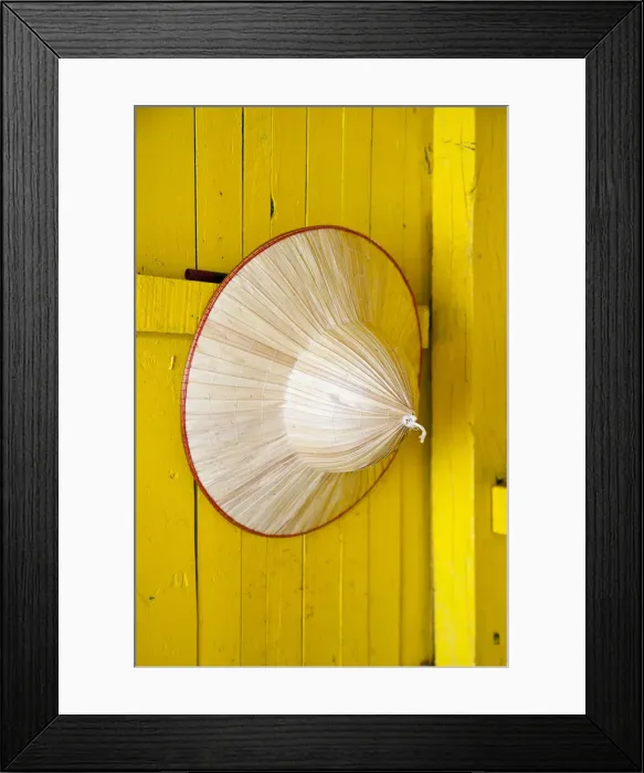 Framed Print : Conical hat hanging on a yellow wall, Halong Bay, Vietnam Framed Print : Conical hat hanging on a yellow wall, Halong Bay, Vietnam
