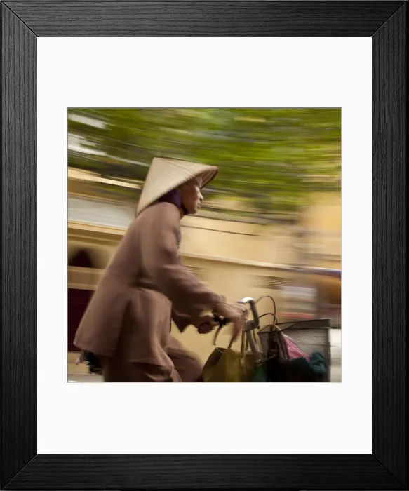 Framed Print : Woman cycling, Hanoi, Vietnam Framed Print : Woman cycling, Hanoi, Vietnam