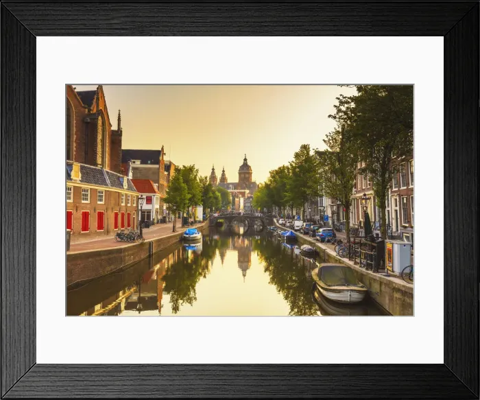 Framed Print : St. Nicholas church reflecting in the water canal at sunrise in Amsterdam Framed Print : St. Nicholas church reflecting in the water canal at sunrise in Amsterdam