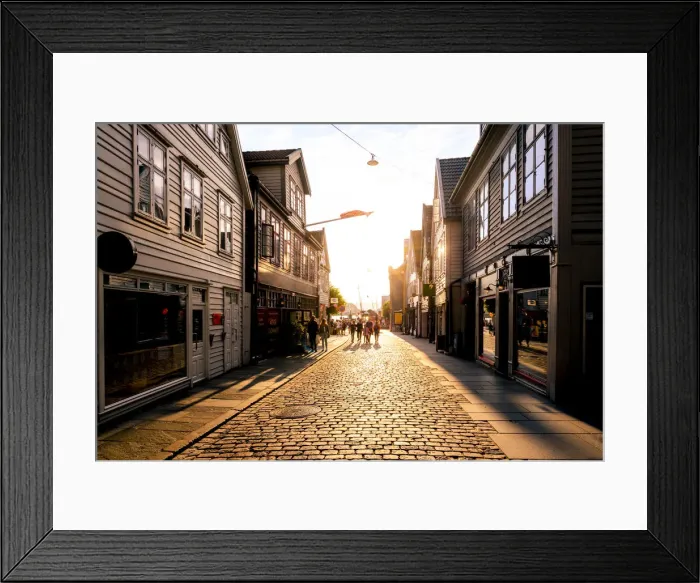 Framed Print : Bergen, Hordaland, Norway. Tourists walking in the old town at sunset Framed Print : Bergen, Hordaland, Norway. Tourists walking in the old town at sunset