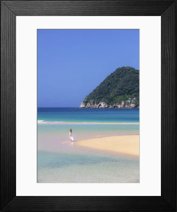 Framed Print : A woman walking on the beach at Awaroa Inlet along the Abel Tasman national park Framed Print : A woman walking on the beach at Awaroa Inlet along the Abel Tasman national park