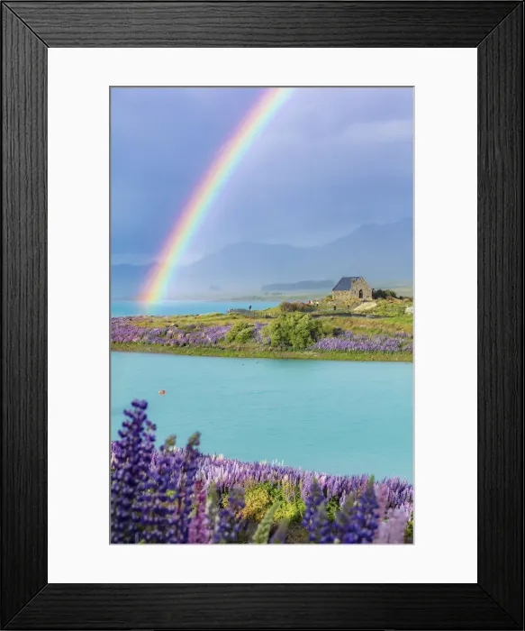 Framed Print : A rainbow over the church of the Good Shepherd and the lupins in bloom by the lake on a Framed Print : A rainbow over the church of the Good Shepherd and the lupins in bloom by the lake on a