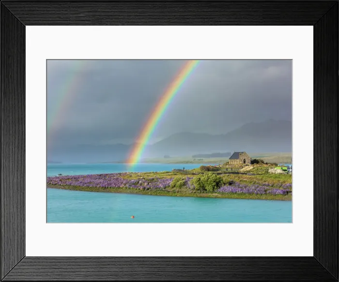 Framed Print : A rainbow over the church of the Good Shepherd and the lupins in bloom by the lake on a