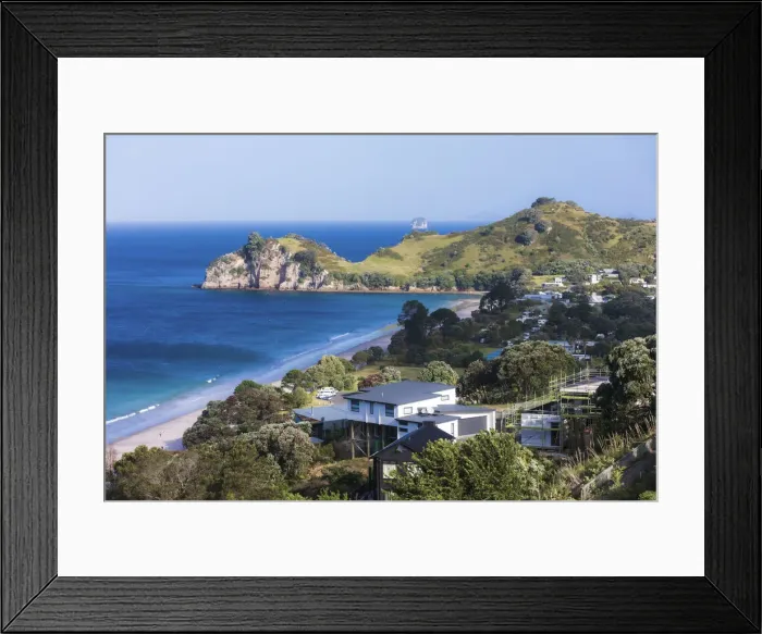 Framed Print : Elevated view of the village and the Tasman sea in the background Framed Print : Elevated view of the village and the Tasman sea in the background
