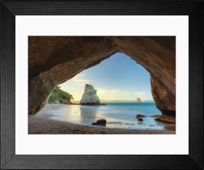 Framed Print : View of a sea stack through a cove at sunset at Cathedral Cove, Coromandel, New Zealand Framed Print : View of a sea stack through a cove at sunset at Cathedral Cove, Coromandel, New Zealand