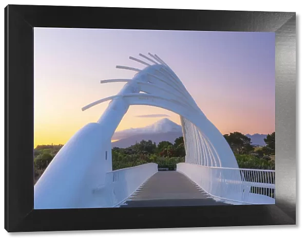 View of the Taranaki volcano in New Zealand through a modern bridge in New Plymouth at
