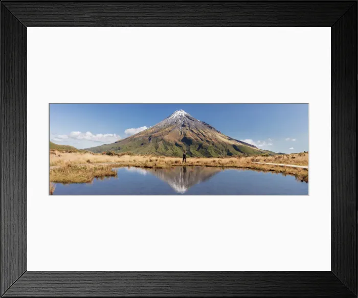 Framed Print : A woman enjoying the view of the Taranaki volcano in New Zealand northern island Framed Print : A woman enjoying the view of the Taranaki volcano in New Zealand northern island