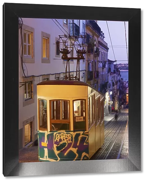 Portugal, Lisbon, Alfama district, Tram at dusk