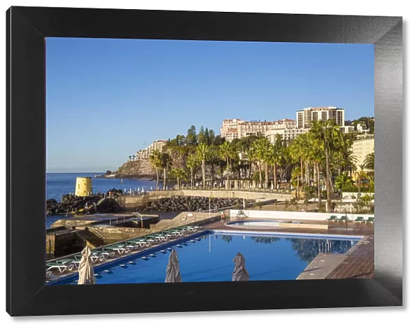 Portugal, Madeira, Funchal, View of swimming pool and Hotel Belmond Reids Palace
