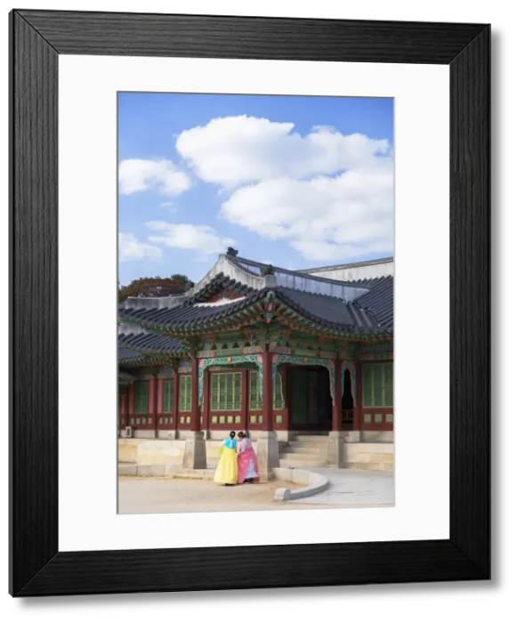 Framed Print : Tourists wearing traditional Korean clothes in Changdeokgung Palace Framed Print : Tourists wearing traditional Korean clothes in Changdeokgung Palace