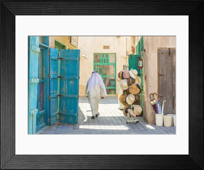 Framed Print : Person walking in Al Seef, Dubai Creek, Dubai, United Arab Emirates Framed Print : Person walking in Al Seef, Dubai Creek, Dubai, United Arab Emirates