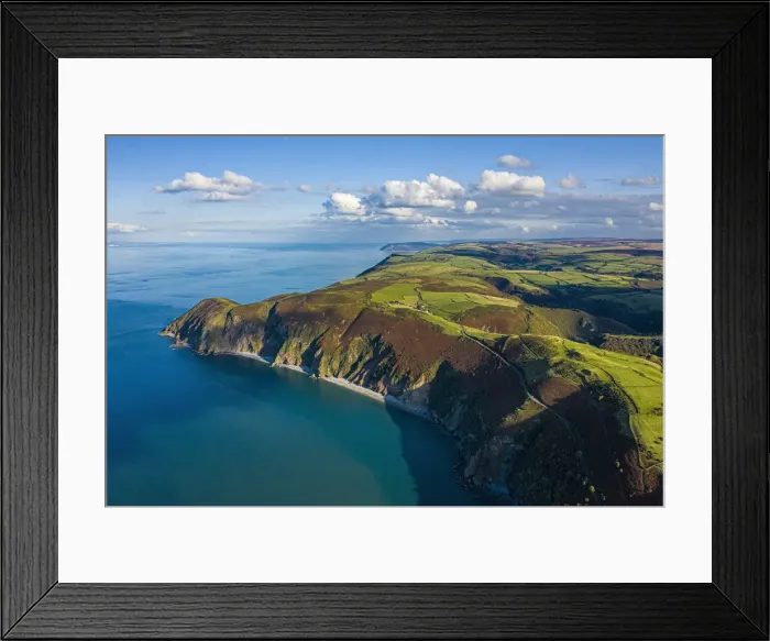 Framed Print : Aerial view over Emoor National Park coastline, Lynton and Lynmouth, North Devon, England Framed Print : Aerial view over Emoor National Park coastline, Lynton and Lynmouth, North Devon, England