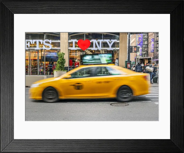 Framed Print : I Love New York gift shop sign and blurred yellow taxi cab passing, Times Square Framed Print : I Love New York gift shop sign and blurred yellow taxi cab passing, Times Square