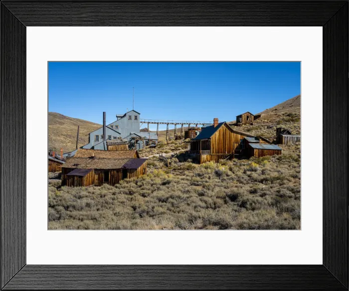 Framed Print : Abandoned wooden structures in Bodie ghost town against clear sky, Mono County Framed Print : Abandoned wooden structures in Bodie ghost town against clear sky, Mono County
