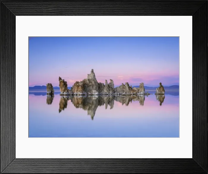 Framed Print : Reflection of rock formation in South Tufa on Mono Lake against blue sky at sunset