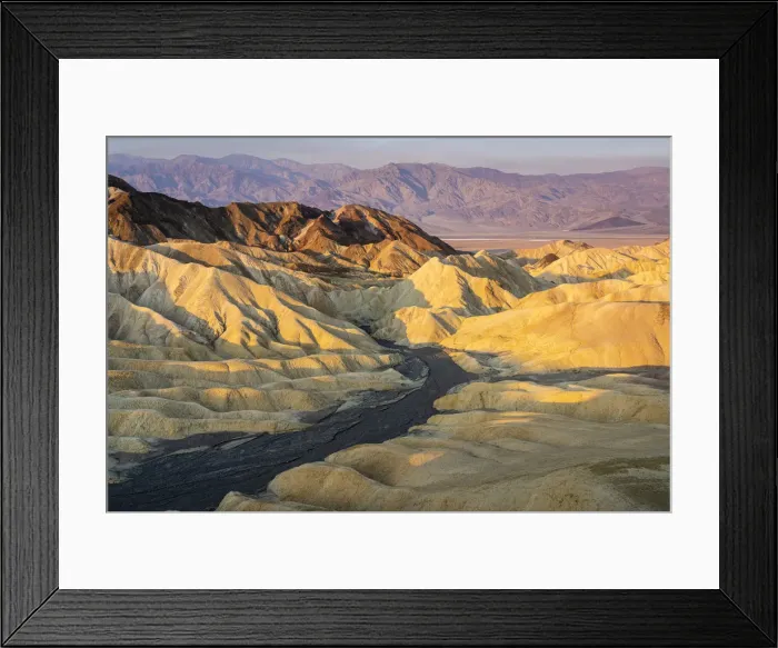 Framed Print : Scenic view of natural rock formations at Zabriskie Point during sunrise