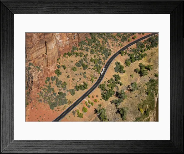 Framed Print : Aerial view of shuttle bus on the scenic drive road taken from Angels Landing Framed Print : Aerial view of shuttle bus on the scenic drive road taken from Angels Landing