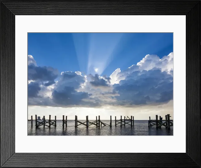 Framed Print : Dramatic clouds and sunbeams over a blue sky. Lake Pontchartrain, New Orleans, Louisiana Framed Print : Dramatic clouds and sunbeams over a blue sky. Lake Pontchartrain, New Orleans, Louisiana