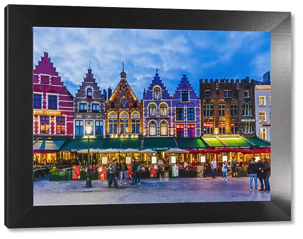 Tourists walking in Market Square in Bruges, Belgium