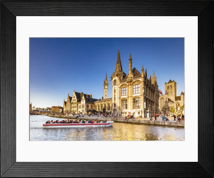 Framed Print : A boat with tourists on the canal with the Ghent town buildings reflecting at sunset Framed Print : A boat with tourists on the canal with the Ghent town buildings reflecting at sunset