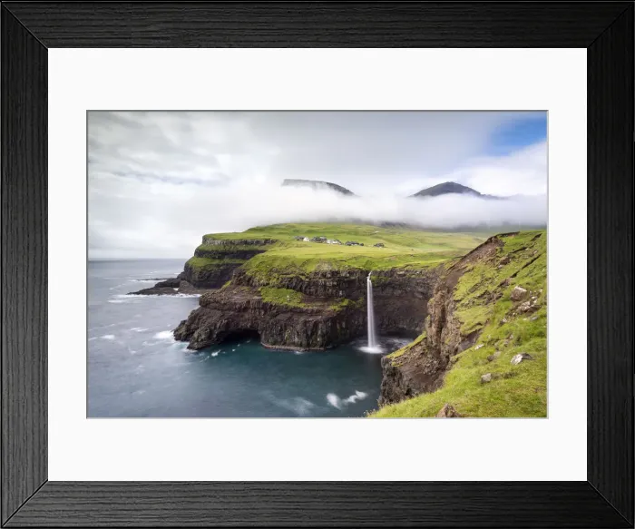 Framed Print : Mulafossur waterfall and the little village of Gasadalur, Vagar island, Faroe Islands