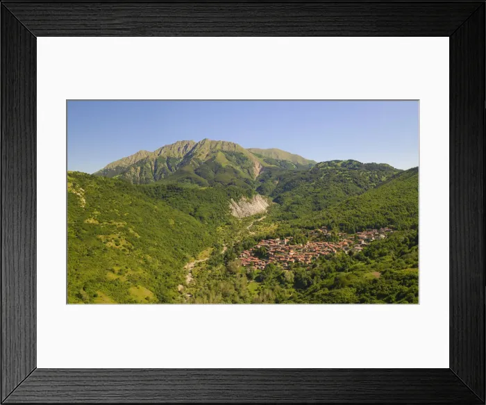 Framed Print : The Alto Mountain and little town of Sassalbo insummer day, municipality of Fivizzano