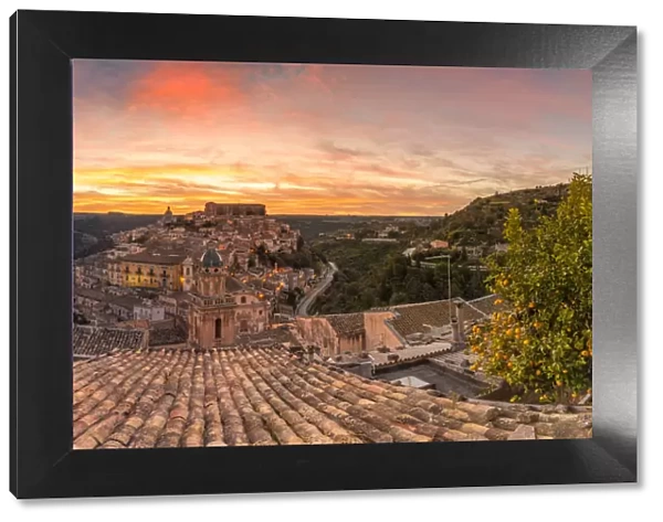 Close up of a typical rooftop with the enchanting hilltop city of Ragusa Ibla in the