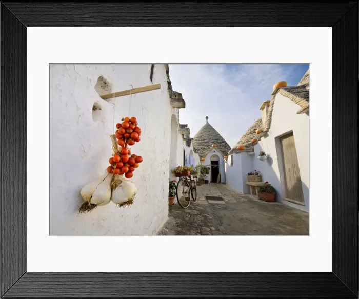 Framed Print : Classic Italian foreshortening in Alberobello, with Trulli, Garlic and Cherry tomatoes Framed Print : Classic Italian foreshortening in Alberobello, with Trulli, Garlic and Cherry tomatoes