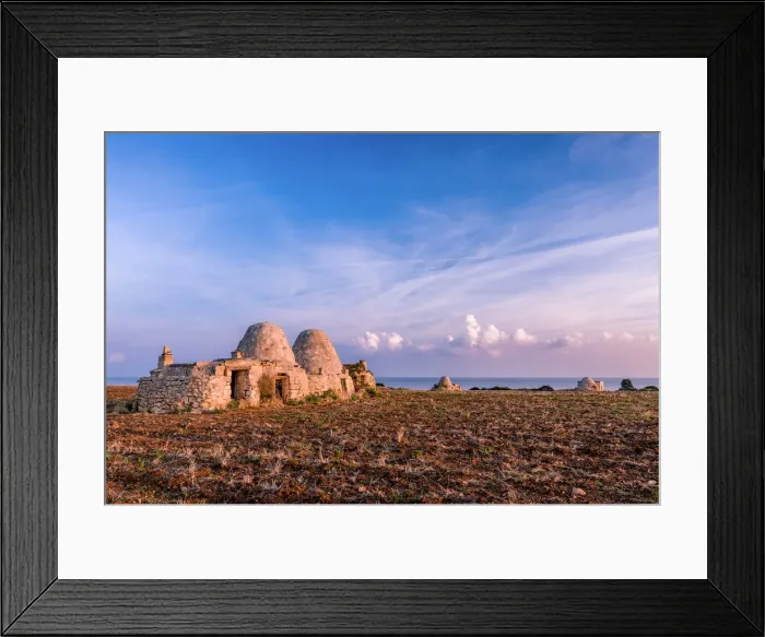 Framed Print : Trulli during the sunrise in a dry field with the sea on the background, Polignano a Mare Framed Print : Trulli during the sunrise in a dry field with the sea on the background, Polignano a Mare