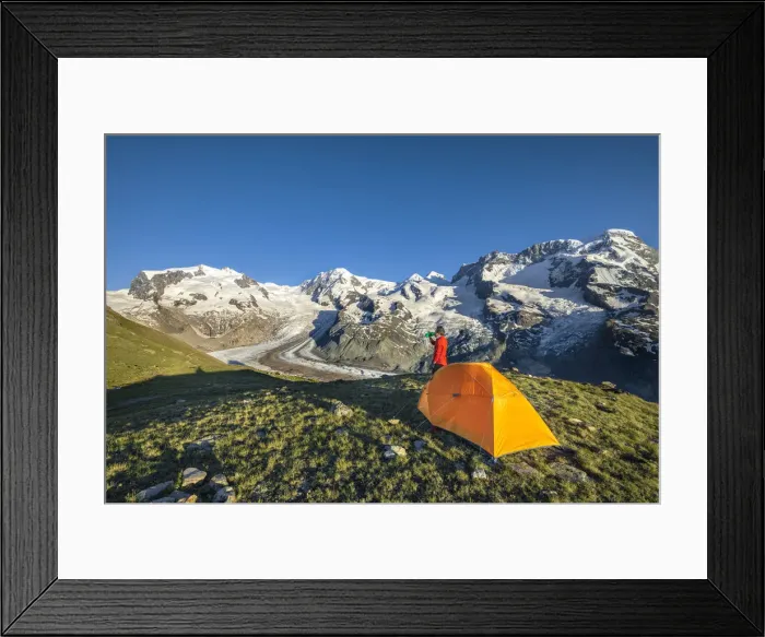 Framed Print : A trekker is in front of the Swiss side of Monte Rosa Massif close to Riffelsee Lake