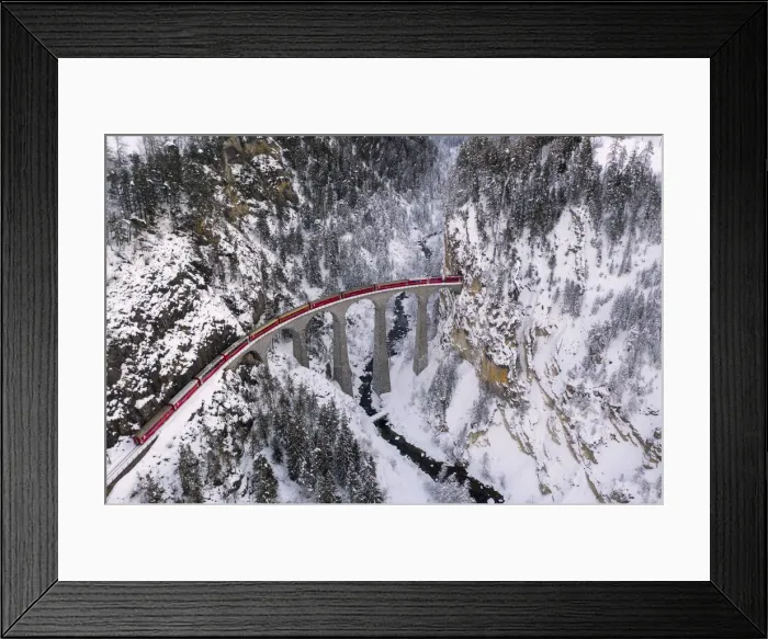 Framed Print : Bernina Express passes through the snowy woods Filisur Canton of Grisons Switzerland Framed Print : Bernina Express passes through the snowy woods Filisur Canton of Grisons Switzerland