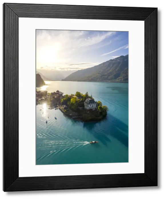 Framed Print : Aerial view of the village of Iseltwald and its peninsula with the old Castle during