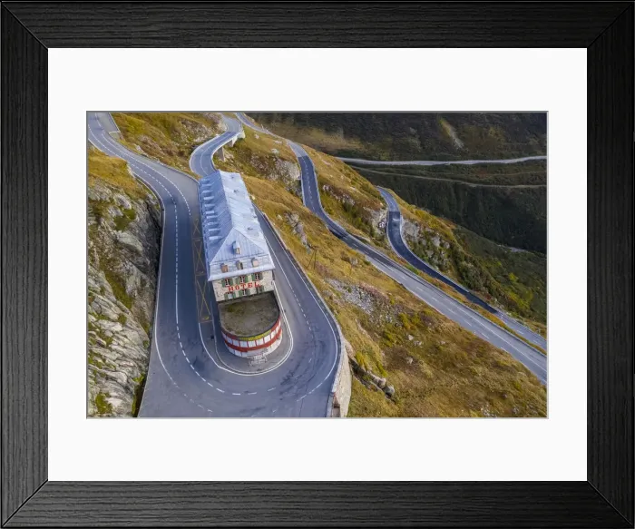 Framed Print : Aerial view of the Belvedere Hotel and the Furka Pass road, famous for a scene of the James Bond film Goldfinger, a high mountain pass in the Swiss Alps connecting Gletsch, Valais with Realp, Uri. Obergoms, Canton of Valais, Swiss Alps, Switzerland Framed Print : Aerial view of the Belvedere Hotel and the Furka Pass road, famous for a scene of the James Bond film Goldfinger, a high mountain pass in the Swiss Alps connecting Gletsch, Valais with Realp, Uri. Obergoms, Canton of Valais, Swiss Alps, Switzerland