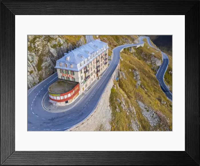 Framed Print : Aerial view of the Belvedere Hotel and the Furka Pass road, famous for a scene of the James Bond film Goldfinger, a high mountain pass in the Swiss Alps connecting Gletsch, Valais with Realp, Uri. Obergoms, Canton of Valais, Swiss Alps, Switzerland