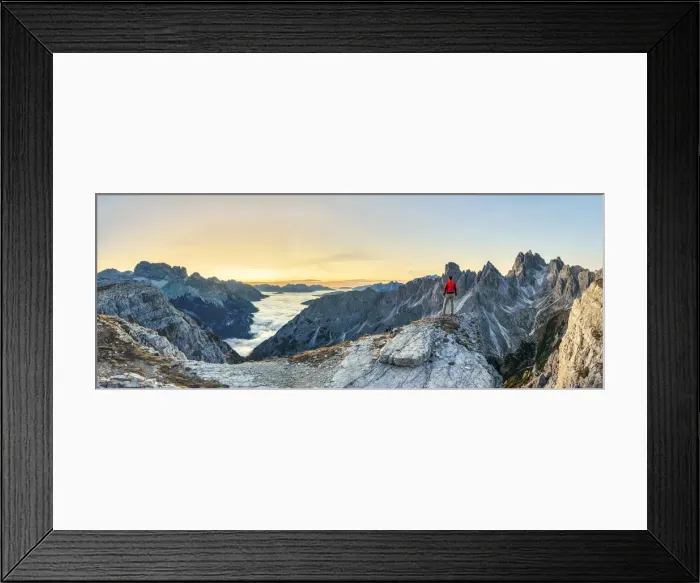 Framed Print : Hiker admiring the Dolomites at sunrise in front of Cadini di Misurina, Auronzo di Cadore