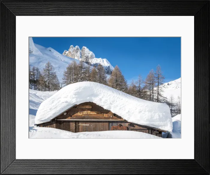 Framed Print : landscape of snow-covered mountain huts in the locality Ciamp de Lobia, Fedaia pass Framed Print : landscape of snow-covered mountain huts in the locality Ciamp de Lobia, Fedaia pass