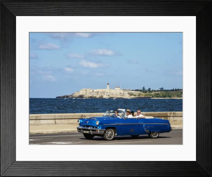 Framed Print : Vintage car at El Malecon with El Morro Castle and Lighthouse in the background, Havana