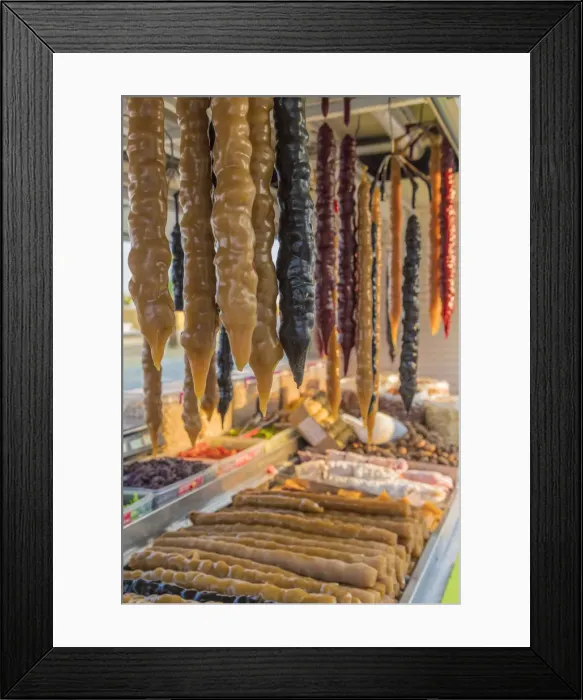 Framed Print : Shushukos for sale in Larnaca Cyprus. Shushukos is a dried grape jelly and walnut sweet Framed Print : Shushukos for sale in Larnaca Cyprus. Shushukos is a dried grape jelly and walnut sweet