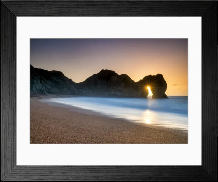 Framed Print : Sunrise Through Durdle Door, Dorset, England Framed Print : Sunrise Through Durdle Door, Dorset, England