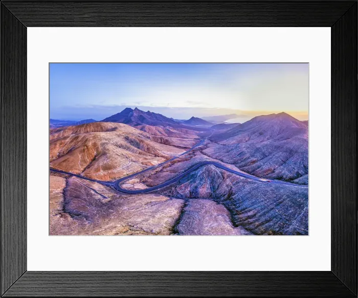 Framed Print : Spain, Canary Islands, Fuerteventura, mountain road crossing the volcanic landscape near Framed Print : Spain, Canary Islands, Fuerteventura, mountain road crossing the volcanic landscape near