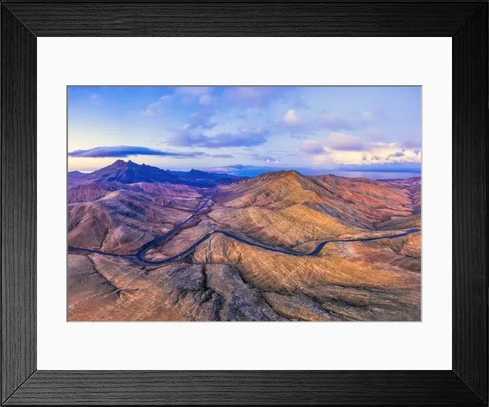 Framed Print : Spain, Canary Islands, Fuerteventura, mountain road crossing the volcanic landscape near Framed Print : Spain, Canary Islands, Fuerteventura, mountain road crossing the volcanic landscape near