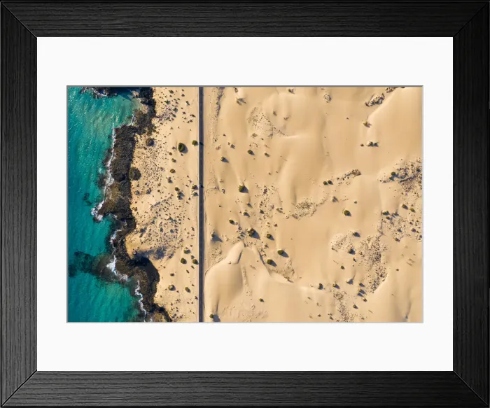 Framed Print : Spain, Canary Islands, Fuerteventura, aerial view of road crossing Corralejo Dunes Framed Print : Spain, Canary Islands, Fuerteventura, aerial view of road crossing Corralejo Dunes